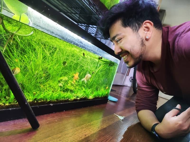 Ismael with one of his fish tanks.